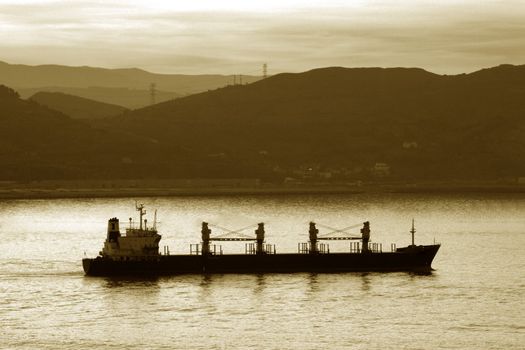 Image of a transportation ship leaving the harbour