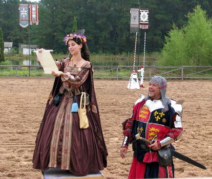 A fair maiden reads a declaration at the Texas Ren Fest Games.