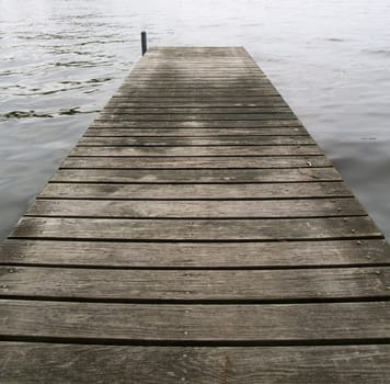 The pier does not look inviting. It is a bridge to sadness.