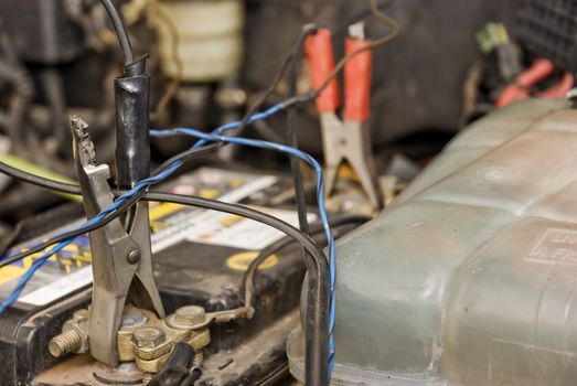 Detail shot of an engine with it's batteries being charged by two battery pegs.