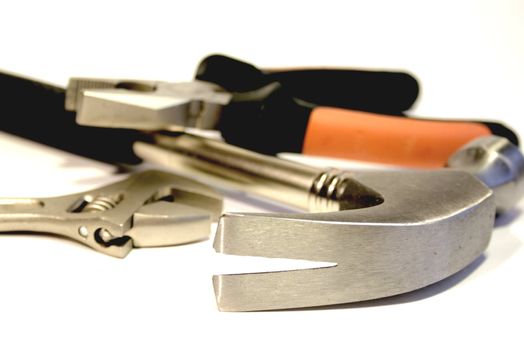 Close-up of Hammer, Pliers and adjustable Spanner