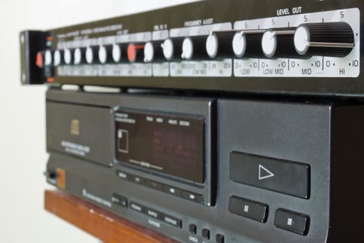 Perpendicular shot of a crossover on top of a CD player.