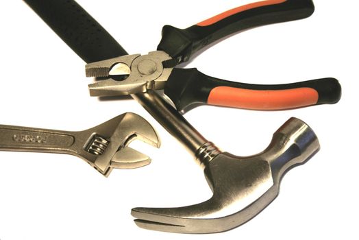 Close-up of Hammer, Pliers and adjustable Spanner