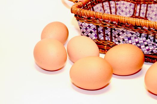 Brown Eggs Near Straw Basket