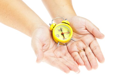 Clock on hand as time management concept