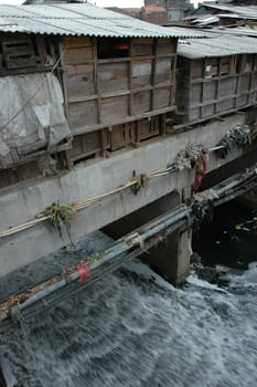 portrait of slum area below pasupati bridge in bandung