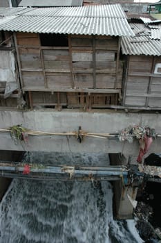 portrait of slum area below pasupati bridge in bandung