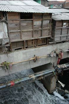 portrait of slum area below pasupati bridge in bandung