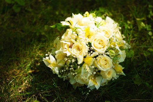 Bridal bouquet on a green meadow