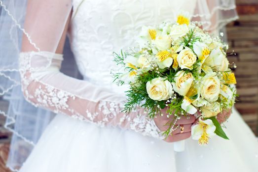 Bridal bouquet in the hand of bride