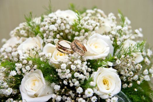 Wedding rings on a bridal bouquet