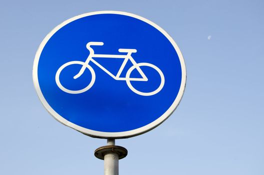 White bicycle sign in blue background. Road sign bicycle path.