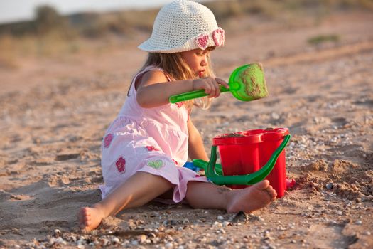 people series: little girl are play the game with sand