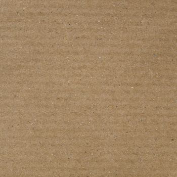 Brown corrugated cardboard sheet useful as a background