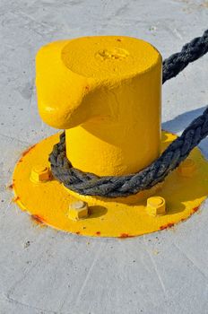 Twisted rope on the cast iron mooring bollard