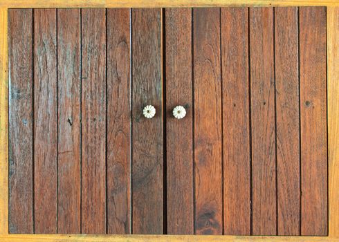 Closed window with old wood shutters