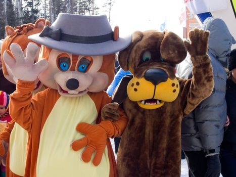  Animators in suits of a dog and fiber.