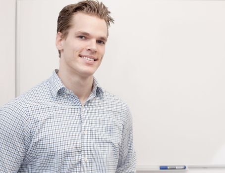 Handsome Businessman in front of a whiteboard