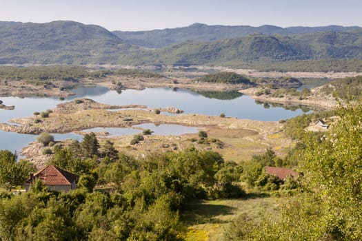Village on coast of Slano lake in Montenegro near Niksic.