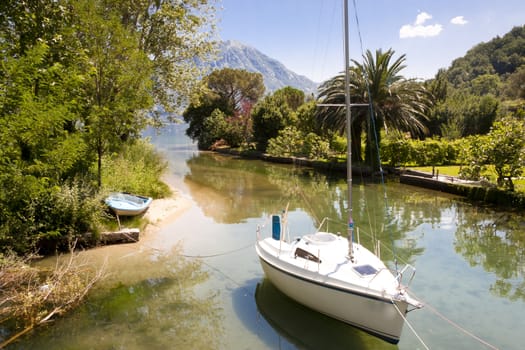 Small beauty sailing boat. Canal in Montenegro.