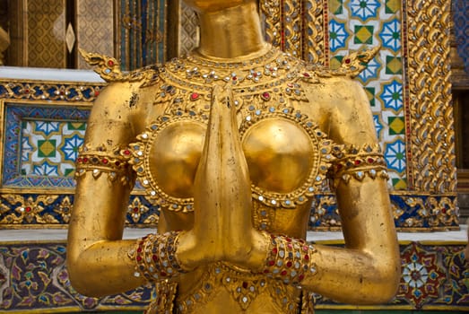 Golden female Garuda body shot at the grand palace, Bangkok, Thailand