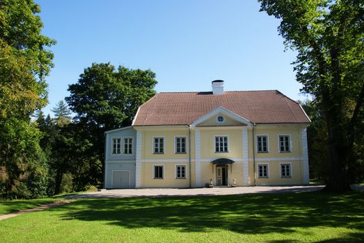 The house of manor on a background of trees