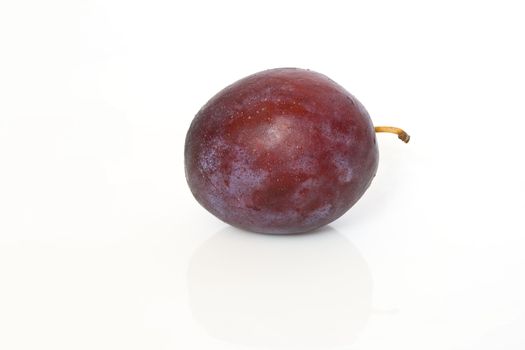 single red plum isolated on white background