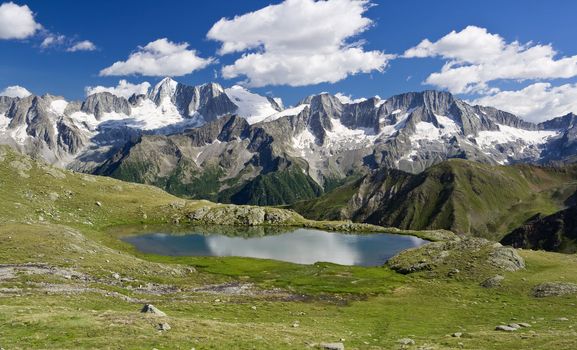 Strino lake is a little amazing lake in italian alps in Val di Sole, Trentino. 	
It is situated at 2800 meters in height near Tonale pass. In the background the Presanella glacier.
The photo is taken with use of  polarizer filter