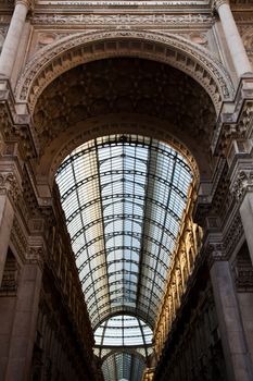 The Galleria Vittorio Emanuele II is a covered double arcade formed of two glass-vaulted arcades at right angles intersecting in an octagon, prominently sited on the northern side of the Piazza del Duomo in Milan.