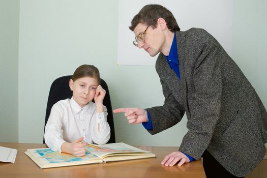 Tutor in a suit and schoolgirl with atlas