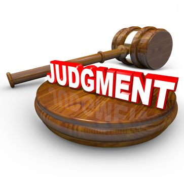 Judgment word on a wooden block and a judge's gavel beside it illustrating the power and decisiveness of the court system in declaring a verdict as a final decision