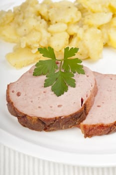 baked bavarian meat loaf on a wooden desk