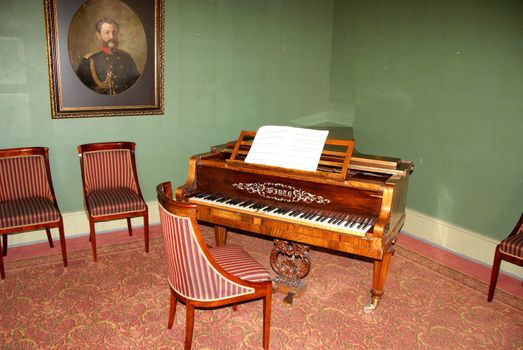 Interior of a room of 18 centuries with a harpsichord