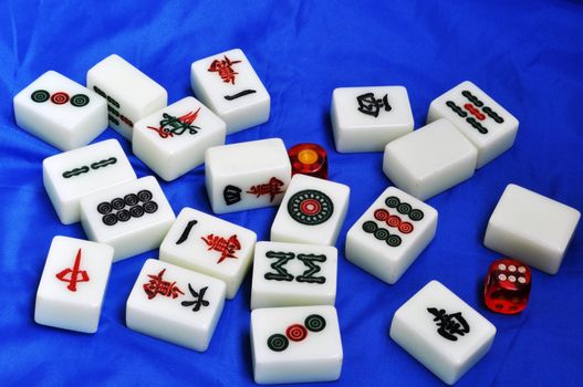 Chinese mahjong tiles on a blue background