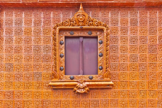 Window on glazed tile background, Thailand temple