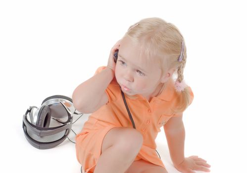 Shot of little girl with mobile in studio