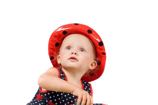 Shot of little girl in polka dot dress in studio