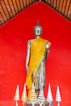 Buddha, stand on red background, Thailand temple