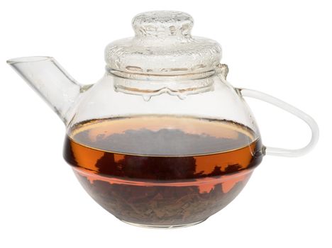 Transparent glass teapot with tea inside on a white background