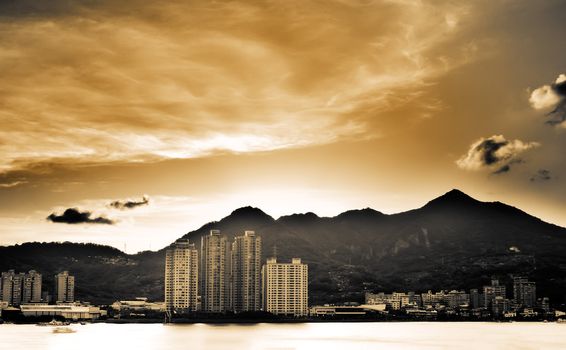 It is a beautiful cityscape with sunset clouds.
