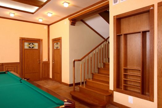 Ladder upwards from a natural tree in a billiard room