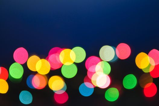 Out of focus multicolored Christmas light background