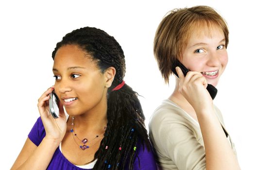 Isolated portrait of two teenage girls with cell phones