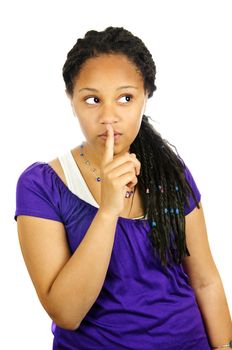 Isolated portrait of black teenage girl gesturing for quiet