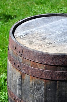 Detail of rusty metal on wood barrel