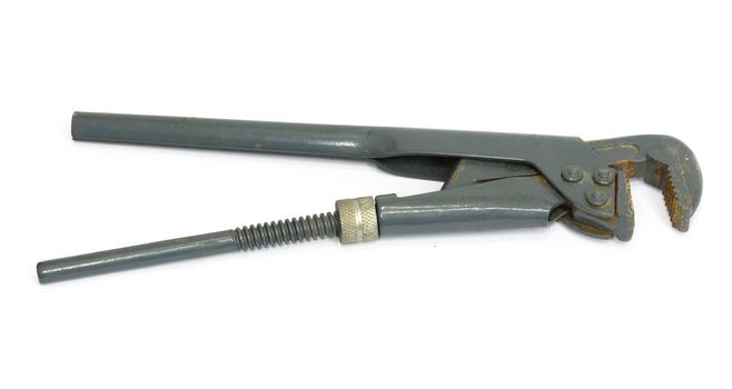 old adjustable spanner under the white background 