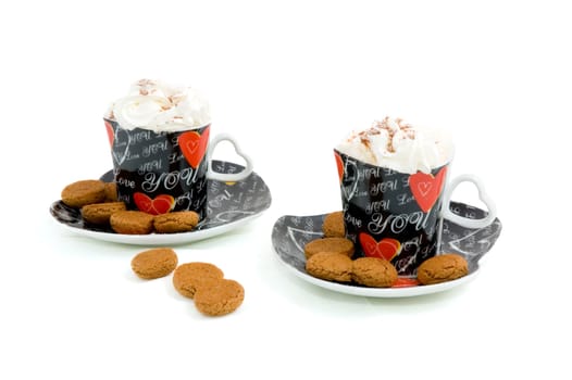 heart shape cups with coffee and whipped cream on white