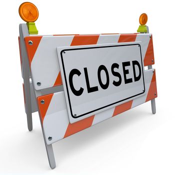 A construction barricade with the word Closed on it, signifying that a road or street is closed off for access due to work being done, or that a website or other business is down for repairs or rebuilding