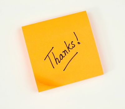 A note of thanks scribbled on a bright color post-it pad