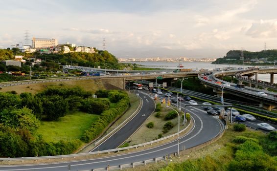 It is a beautiful cityscape of interchange and cars.